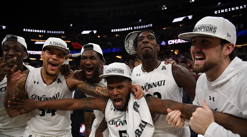 The Cincinnati Bearcats celebrate their championship over Houston Cougars at the final game of the 2018 AAC Basketball Championship at Amway Center on March 11, 2018 in Orlando, Florida. (Photo by Mark Brown/Getty Images)
