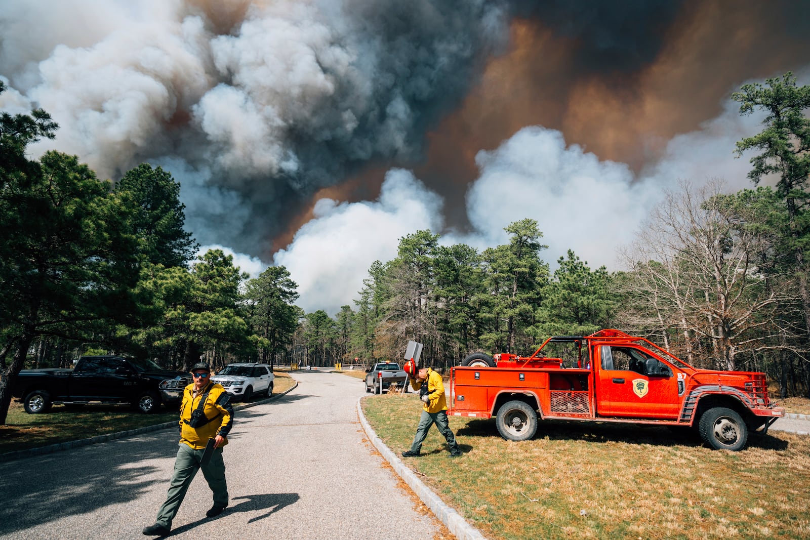 Firefighters battle a wildfire in Ocean County, N.J. on Thursday, April 24, 2025. (New Jersey Department of Environmental Protection via AP)