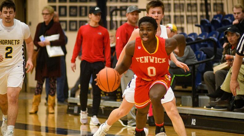 Fenwick’s Caleb Davis (0) leads a fast break during Wednesday night’s Division II sectional basketball game against Monroe at Fairmont’s Trent Arena. Fenwick won 60-39. ROB MCCULLEY/RAM PHOTOGRAPHY
