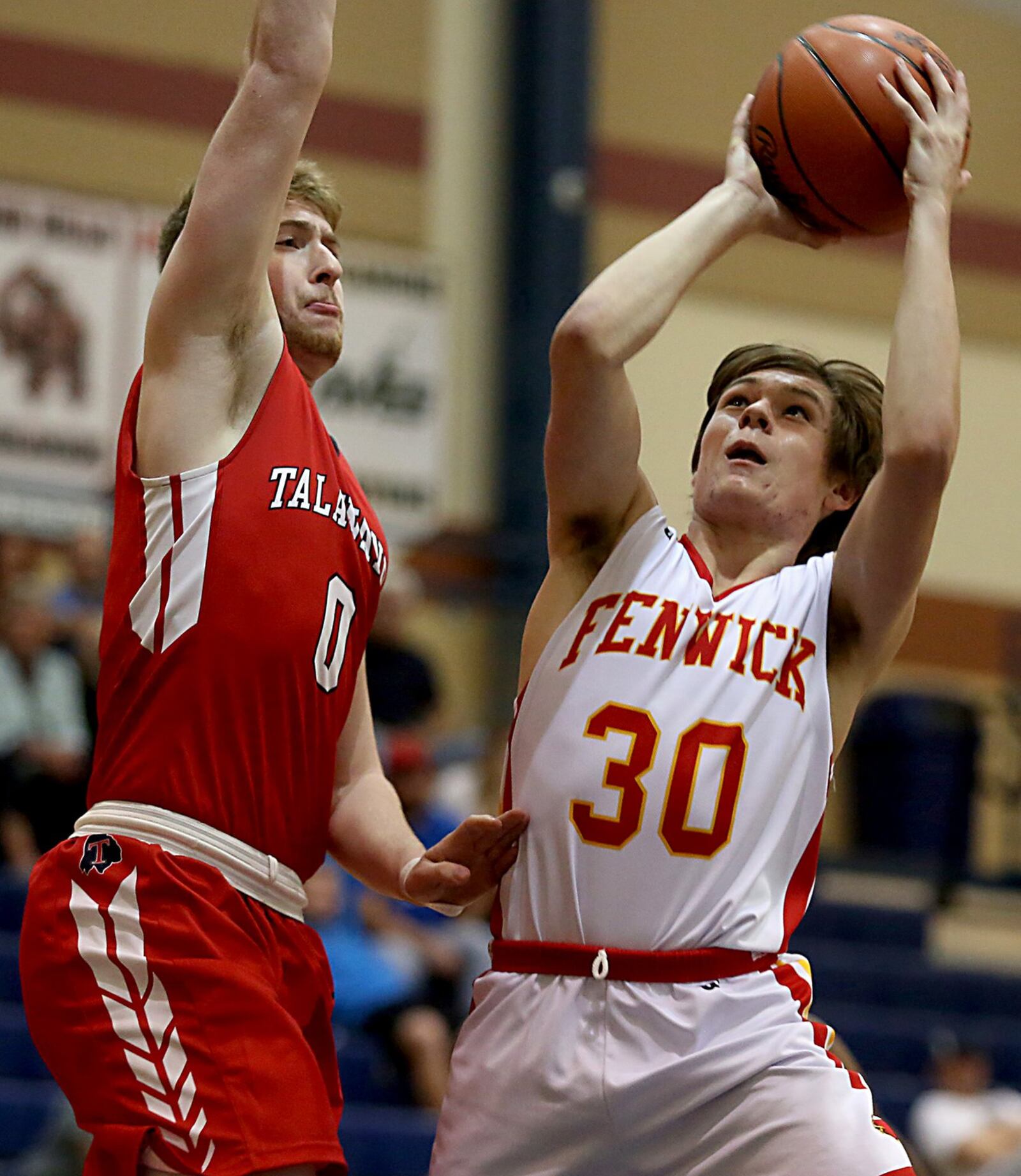 Fenwick’s John Engelmeier puts up a shot against Talawanda’s Evan James on Saturday during the inaugural All-Butler County All-Star boys basketball game at the Hamilton Athletic Center. CONTRIBUTED PHOTO BY E.L. HUBBARD