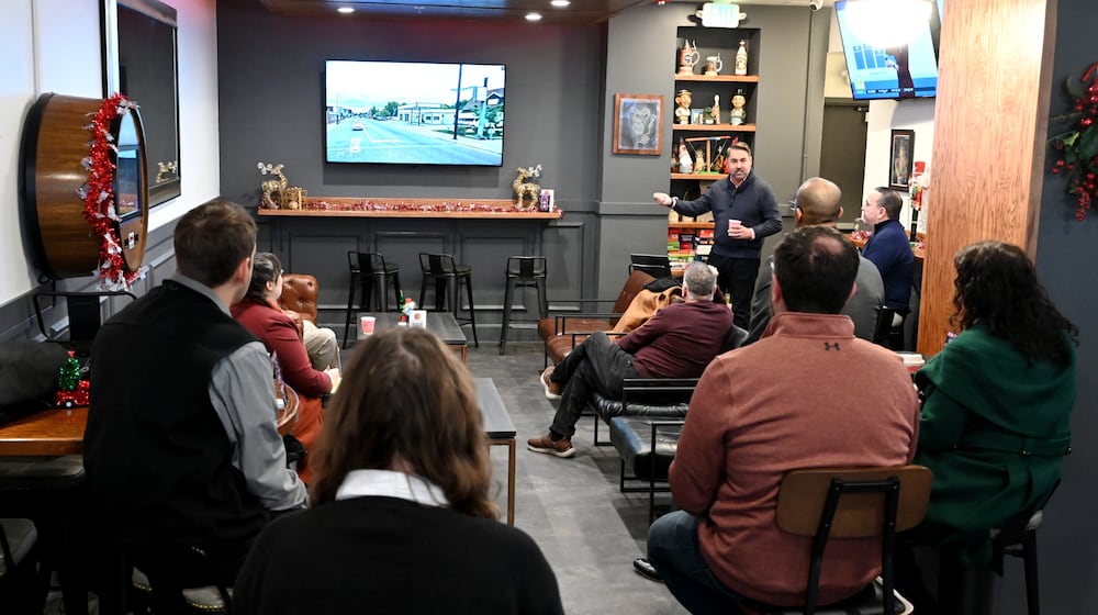 Butler County Finance Authority President and CEO Joshua Smith talks about the revitalization efforts in Hamilton during his tenure as city manager. Middletown leaders are considering a project that would demolish the Manchester Inn and construct a new mixed-use development that would include 100 to 125 apartments and 10,000 to 15,000 square feet of retail space. The meeting was held on Dec. 8, 2025, at the Pour House, which is at the Marcum in Hamilton, a CMC Properties building. MICHAEL D. PITMAN/STAFF