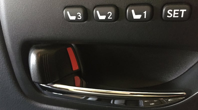 The inside lock button usually shows red when the door is unlocked and usually locks automatically when the gear selected is moved into Drive or after a certain speed has been reached. James Halderman photo