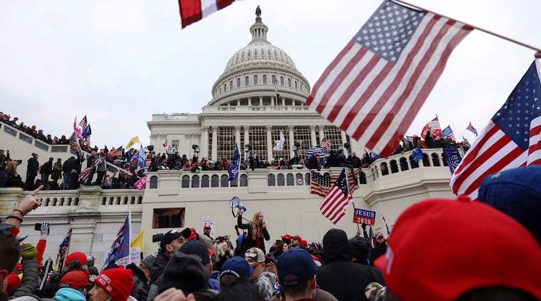 FILE - In this Wednesday, Jan. 6, 2021 file photo, supporters of President Donald Trump gather outside the U.S. Capitol in Washington. (AP Photo/Shafkat Anowar)