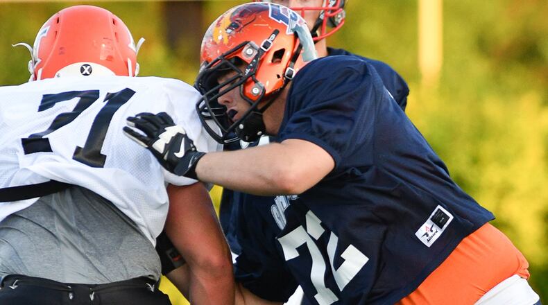 Franklin’s Wyatt Hillard guards National Trail’s Tyler Glander during the Miami Valley Football Coaches Association’s all-star game on Friday night at Centerville Stadium. BRYANT BILLING / CONTRIBUTED