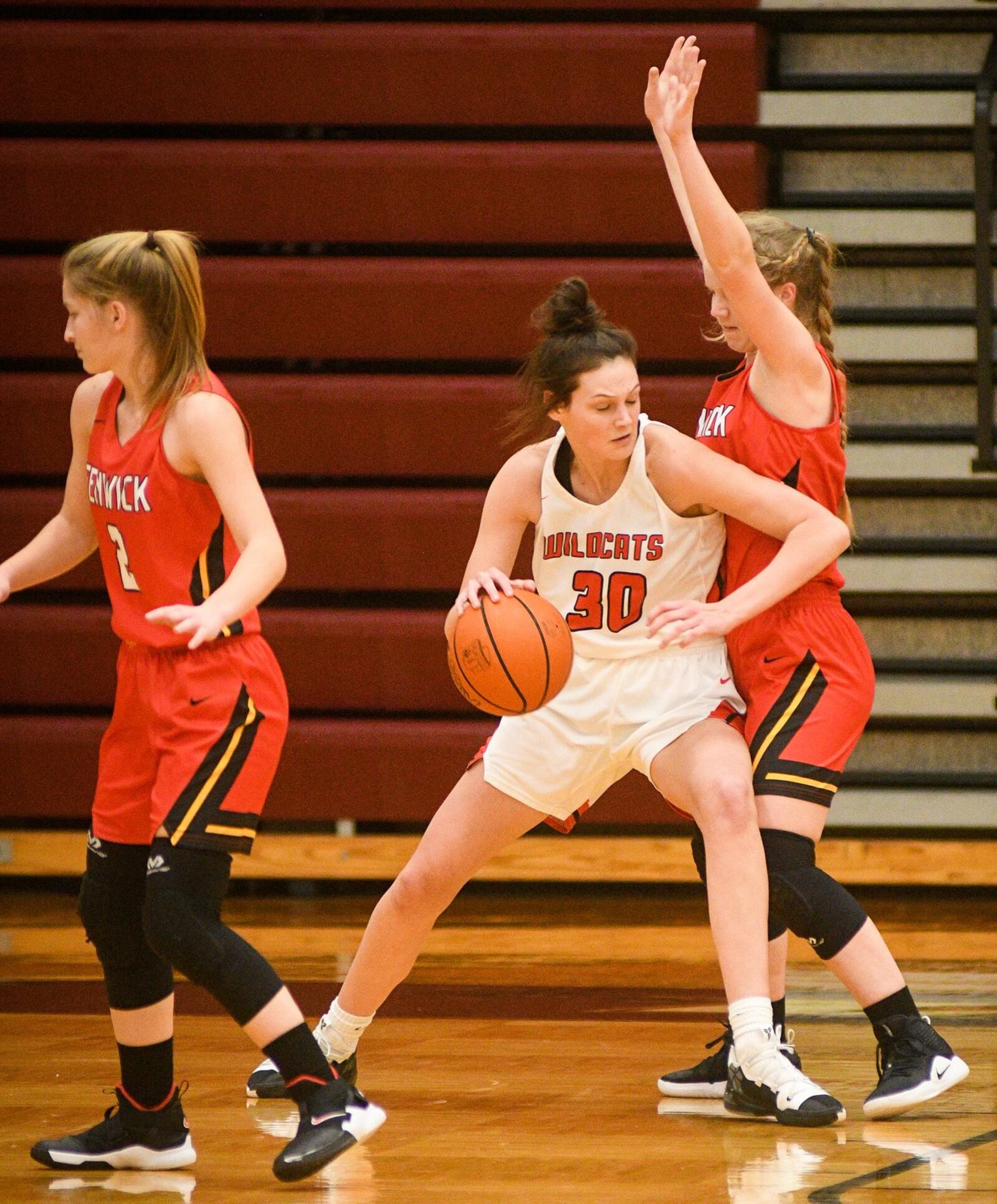 Franklin’s Layne Ferrell (30) dribbles against Fenwick’s Rachel Tebbe (10) during Monday night’s Division II district basketball semifinal at Lebanon. Franklin won 47-35. ROB MCCULLEY/RAM PHOTOGRAPHY