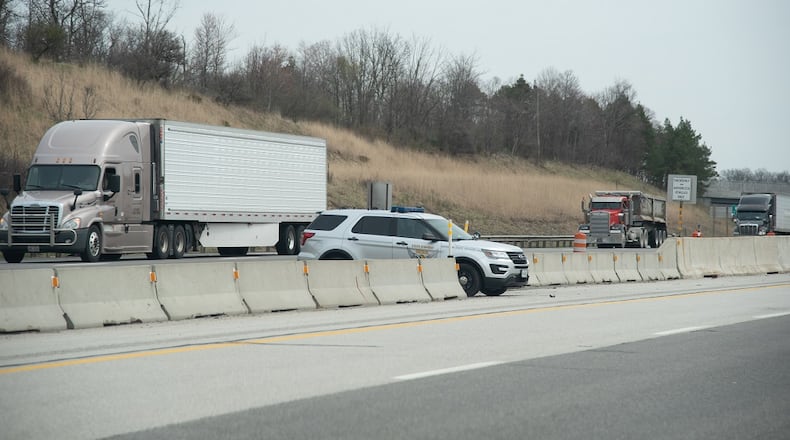 An Ohio Highway trooper hiding behind center barrier on the interstate monitoring motorists. MICHAEL T HARTMAN / SHUTTERSTOCK