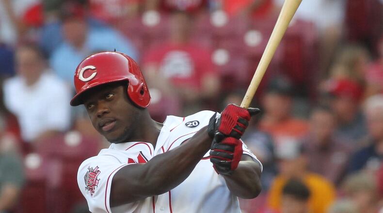 Reds outfielder Aristides Aquino warms up before an at-bat against the Cardinals on Thursday, Aug. 15, 2019, at Great American Ball Park in Cincinnati. David Jablonski/Staff