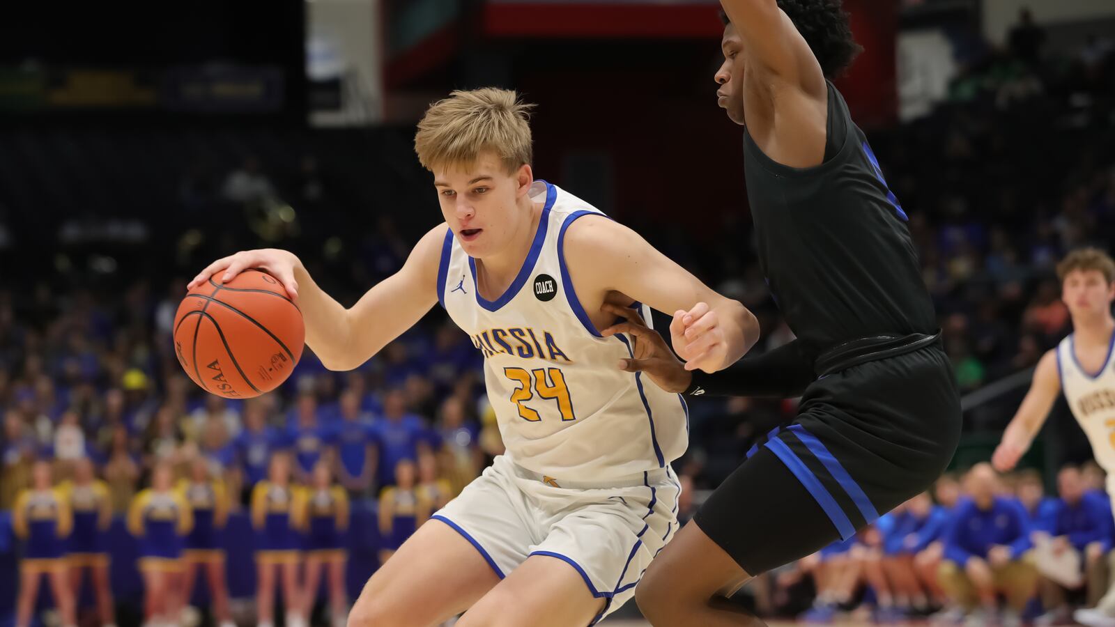Russia High School's Braylon Cordonnier is guarded by Richmond Heights' Jeremy Wilson during a Division IV state semifinal game on Friday, March 17, 2023 at University of Dayton Arena. CONTRIBUTED PHOTO BY MICHAEL COOPER