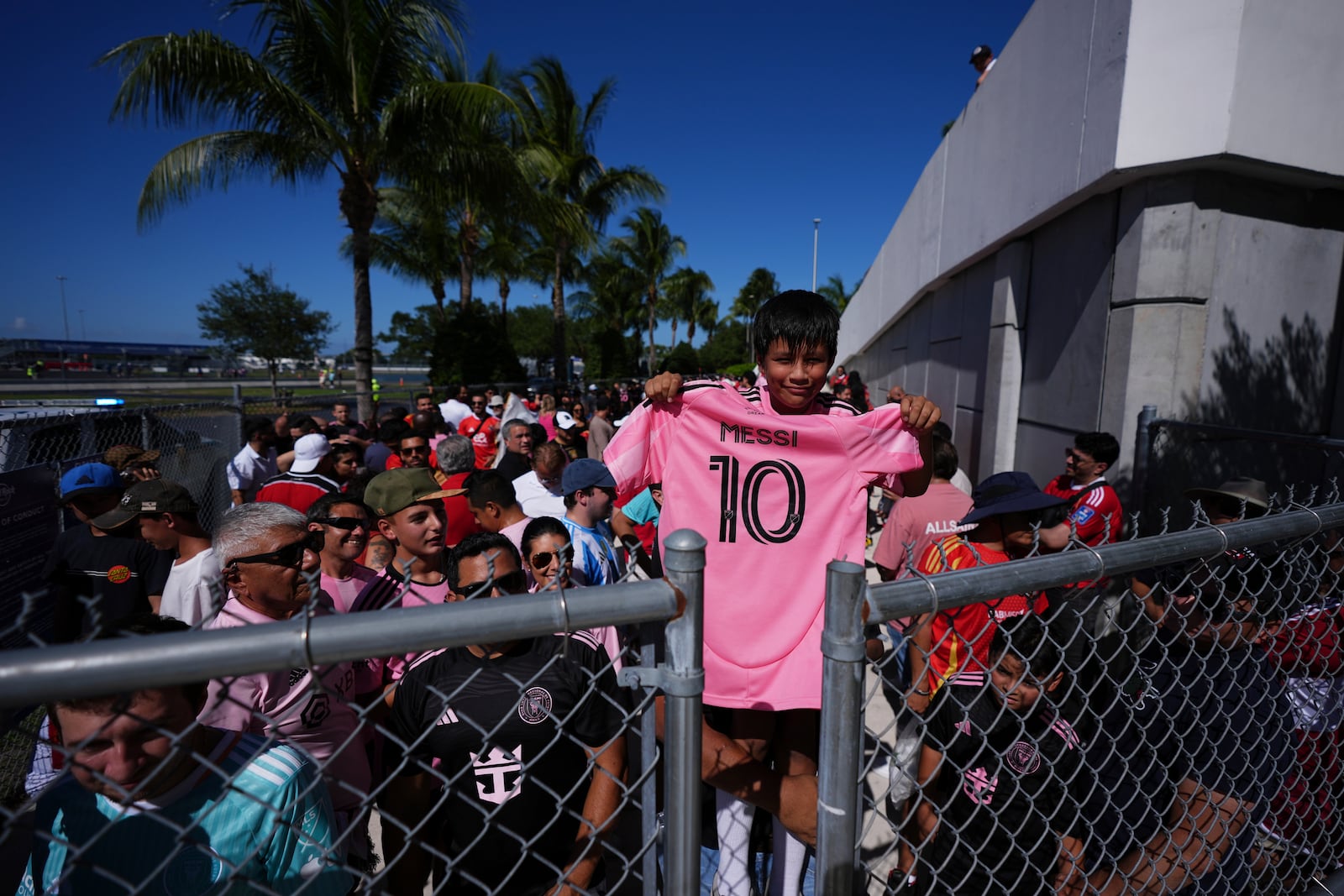Bernardo Gasca, 10, holds an Inter Miami's Lionel Messi jersey before entering Hard Rock Stadium for the Club World Cup group A soccer match between Al Ahly and Inter Miami in Miami, Fla., Saturday, June 14, 2025. (AP Photo/Rebecca Blackwell)