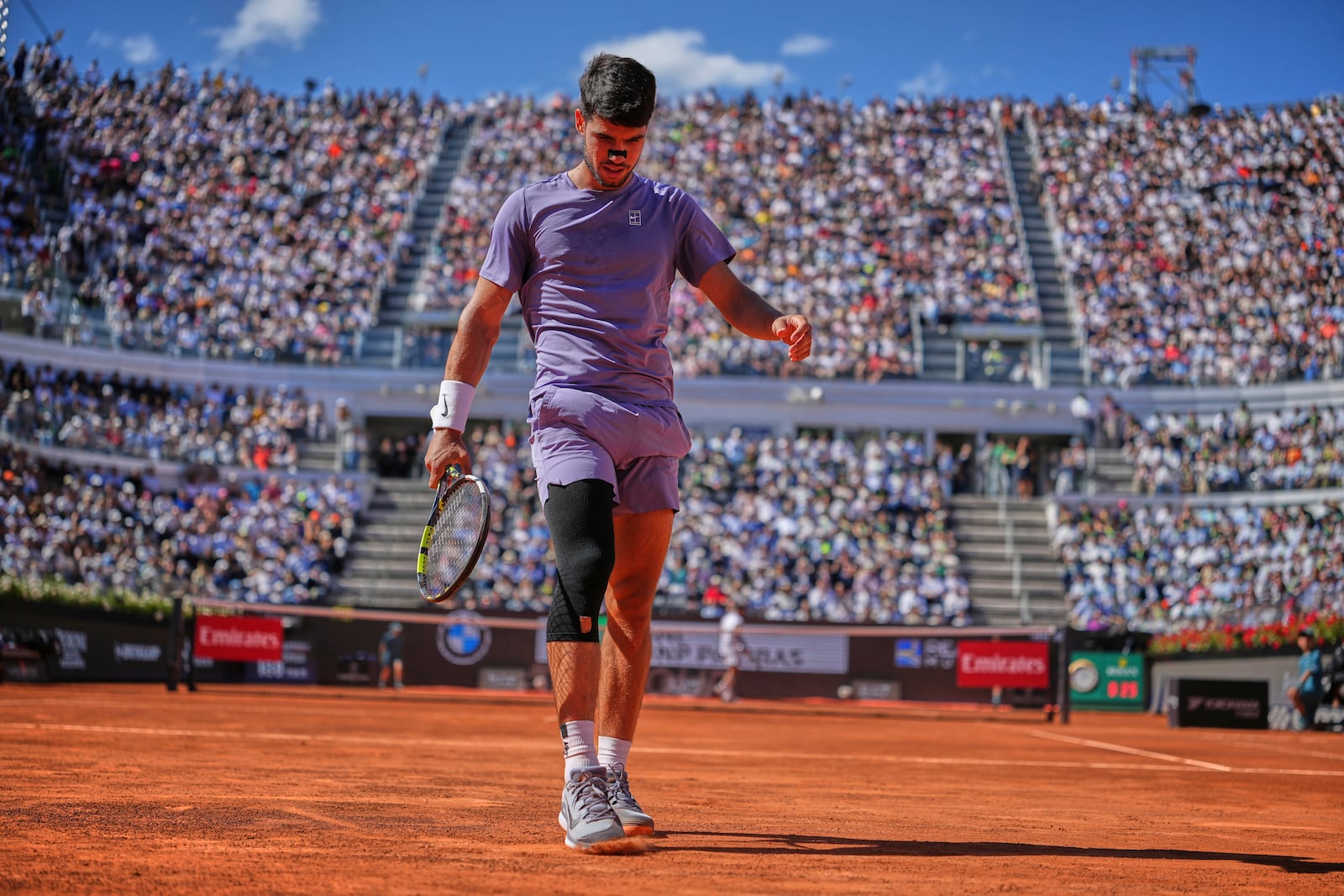 Spain's Carlos Alcaraz walks on the court during the semifinal tennis match against Italy's Lorenzo Musetti at the Italian Open, in Rome, Friday, May 16, 2025. (AP Photo/Andrew Medichini)