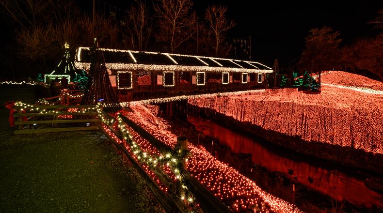 The historic Clifton mill, built in 1802 and still working, opened its Legendary Lights for the 2019 holiday season on Friday, Nov. 29. Four million lights cover Clifton Mill’s scenic attributes, including the mill, a covered bridge, cliffs and riverbanks. Last December, Clifton Mill was the winner of a $50,000 prize on ABC show “The Great Christmas Light Fight.” TOM GILLIAM / CONTRIBUTING PHOTOGRAPHER
