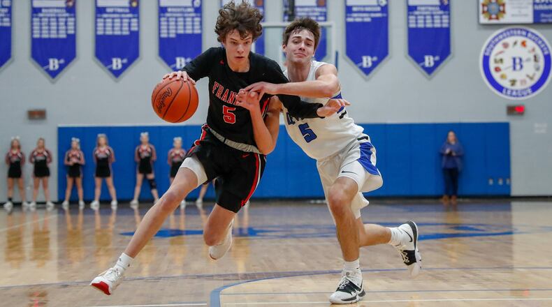 Franklin’s Noah Rich is guarded by Brookville’s Daniel Dominique during their game last season in Brookville. CONTRIBUTED PHOTO BY MICHAEL COOPER