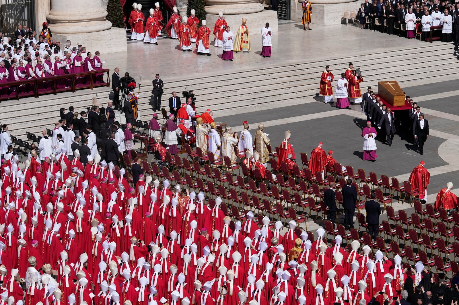 The coffin of Pope Francis is carried into St Peter's Square for his funeral, at the Vatican, Saturday, April 26, 2025. (AP Photo/Gregorio Borgia)