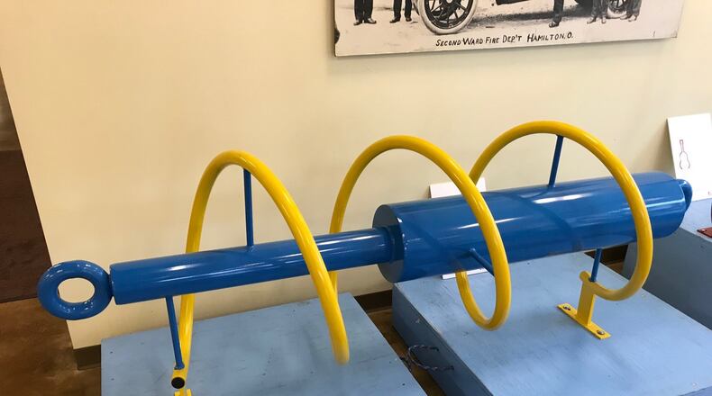The shock absorber bike rack was donated by Thyssenkrupp Bilstein and will be mounted at the trailhead to the Great Miami River recreational trail. NICK GRAHAM/STAFF