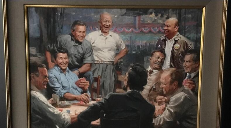 Among the artwork removed was a painting of presidents playing poker with Rosenberger (upper right) overlooking the table. Photo courtesy of 3rdRailPolitics.com