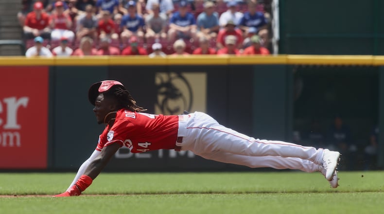 Elly De La Cruz, of the Reds, steals second base in the second inning against the Dodgers on Thursday, June 8, 2023, at Great American Ball Park in Cincinnati. David Jablonski/Staff