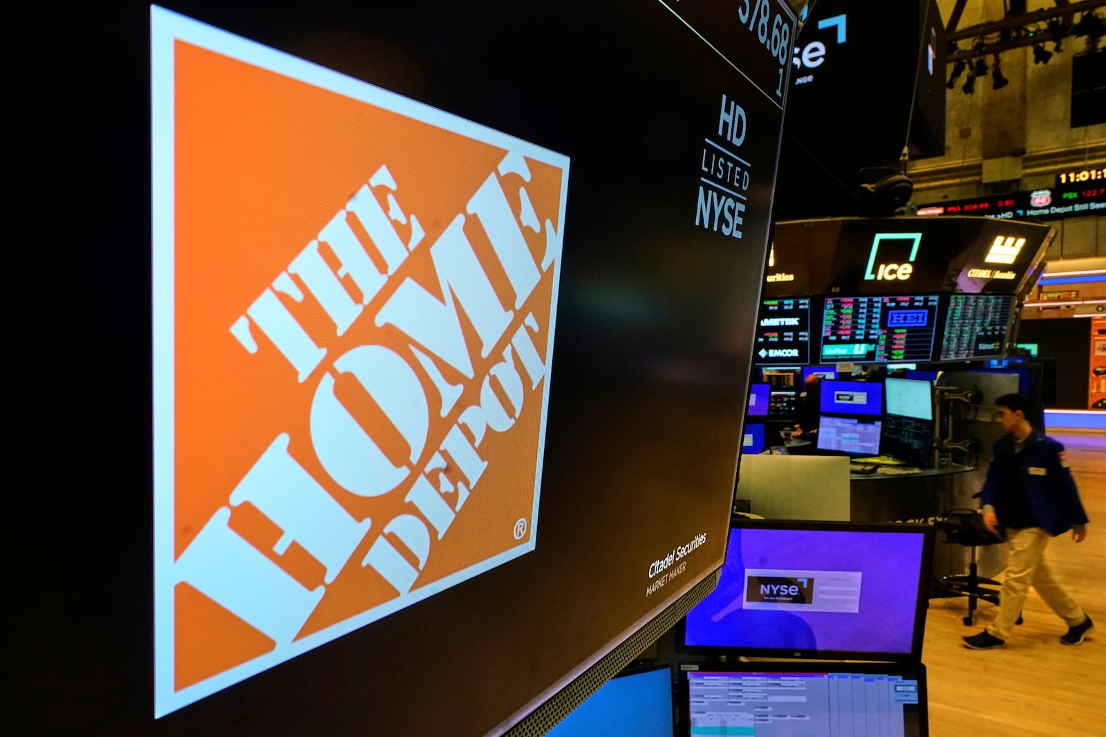 The logo for Home Depot is displayed above a trading post on the floor of the New York Stock Exchange, Tuesday, May 20, 2025. (AP Photo/Richard Drew)