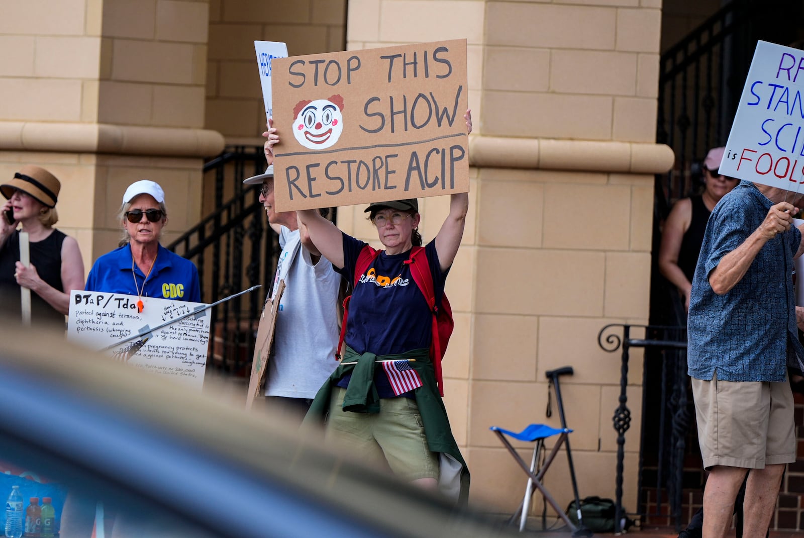 Demonstrators rally for support of the CDC during a meeting of the Advisory Committee in Immunization Practices, Wednesday, June 25, 2025, in Atlanta. (AP Photo/Mike Stewart)