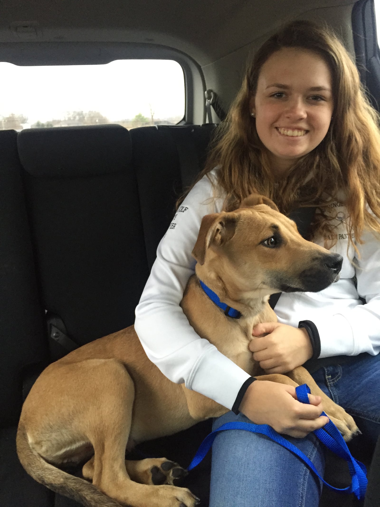 Hannah McCrabb holds Abe after he was adopted on Dec. 30, 2015 from the Animal Friends Humane Society in Hamilton. SUBMITTED PHOTO