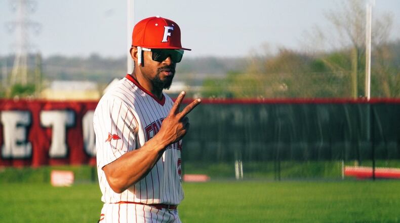Fairfield baseball coach Lance Durham signals to his players during the Indians' 13-0 win over Princeton on Monday night. Chris Vogt/CONTRIBUTED