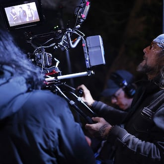 Director of Photography Phillip Booth operates the camera on set of director Lana Read's new film, "Death for Dinner", at the historic home of Helen and Rick Stevens-Gleason in early morning hours Saturday, March 16, 2024 in Middletown. NICK GRAHAM/STAFF