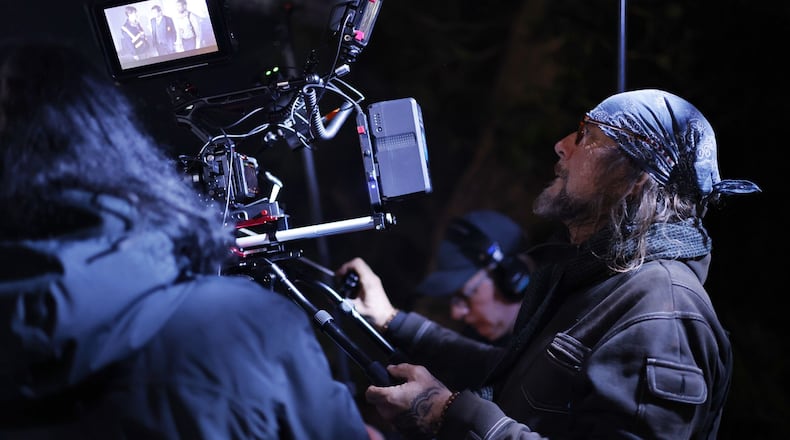 Director of Photography Phillip Booth operates the camera on set of director Lana Read's new film, "Death for Dinner", at the historic home of Helen and Rick Stevens-Gleason in early morning hours Saturday, March 16, 2024 in Middletown. NICK GRAHAM/STAFF