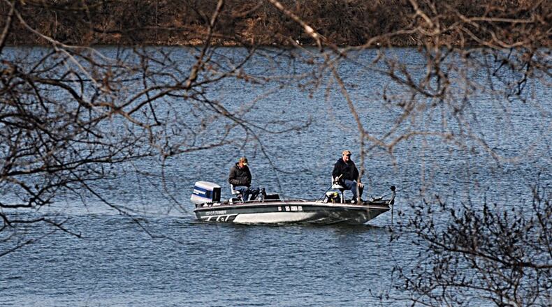 Fisherman take advantage of sunny skies and warm weather on Eastwood Lake in February. MARSHALL GORBY / STAFF