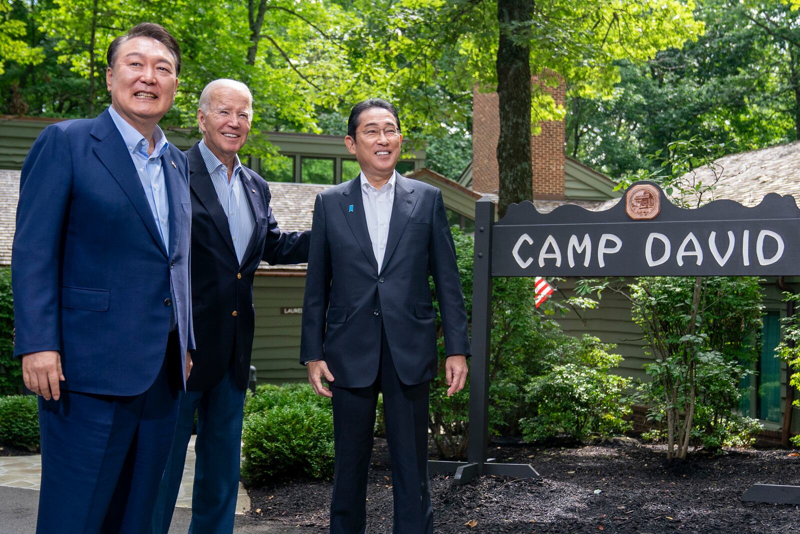 FILE - President Joe Biden greets South Korea's President Yoon Suk Yeol, left, and Japan's Prime Minister Fumio Kishida, right, on Aug. 18, 2023, at Camp David, the presidential retreat, near Thurmont, Md. (AP Photo/Andrew Harnik, File)