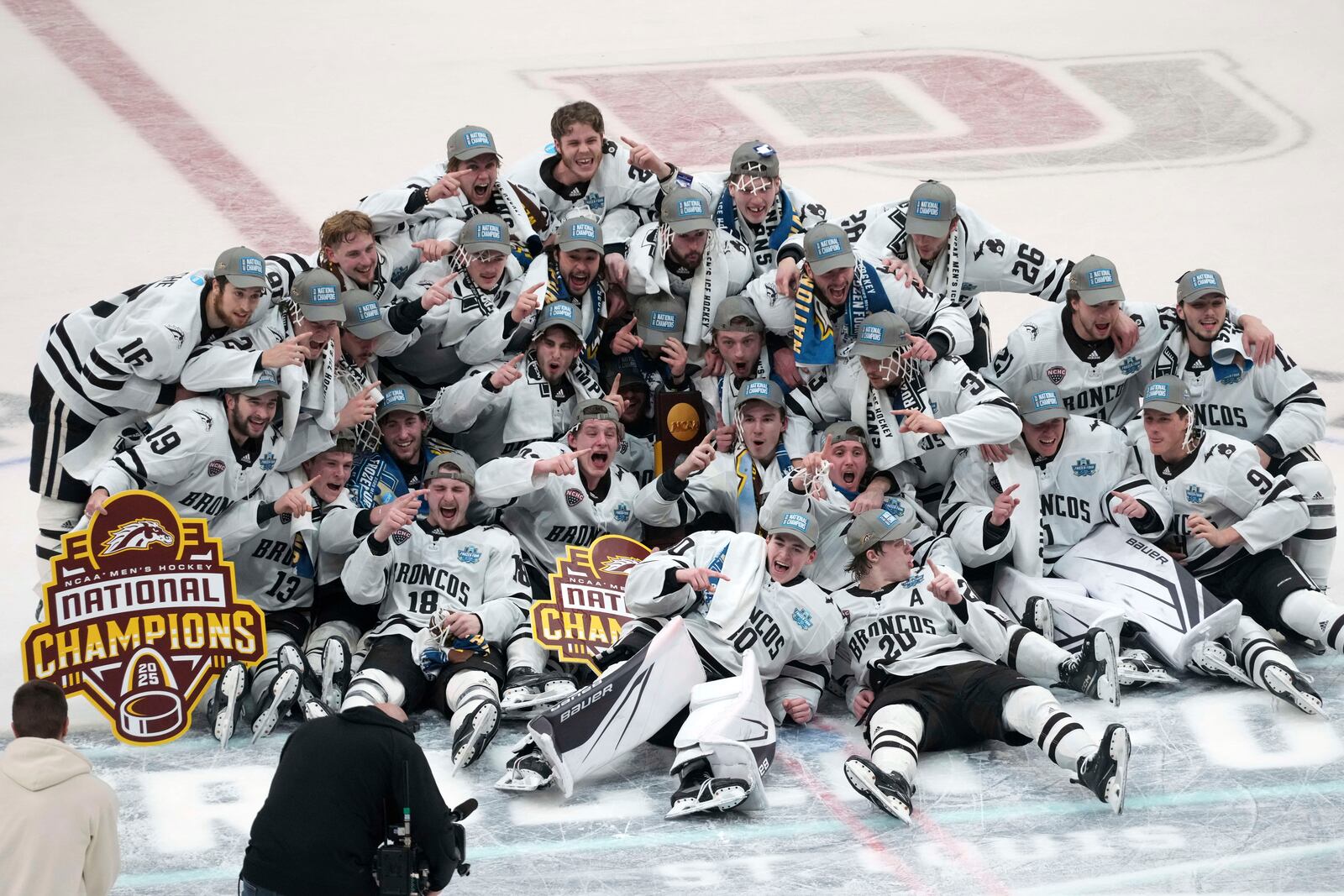 Members of Western Michigan celebrate after defeating Boston University in the championship game of the NCAA Frozen Four men's college hockey tournament, Saturday, April 12, 2025, in St. Louis (AP Photo/Jeff Roberson)