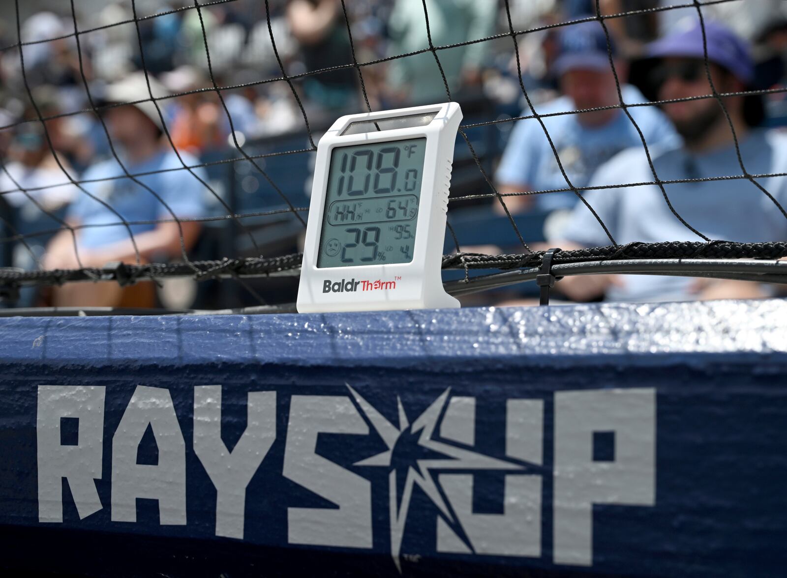 A thermometer on top of the Tampa Bay Rays' dugout displays 108 degrees Fahrenheit during the second inning of a baseball game against the Detroit Tigers Saturday, June 21, 2025, in Tampa, Fla. (AP Photo/Jason Behnken)