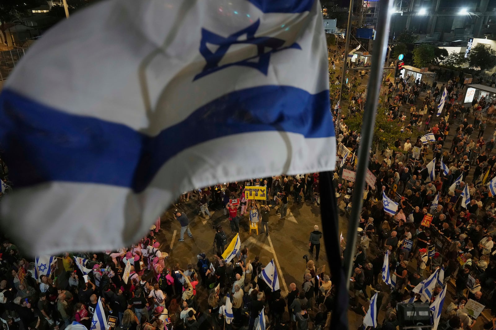 People take part in a protest demanding the end of the war and immediate release of hostages held by Hamas in the Gaza Strip, and against Prime Minister Benjamin Netanyahu's government in Tel Aviv, Israel, Saturday, May 3, 2025.(AP Photo/Ariel Schalit)