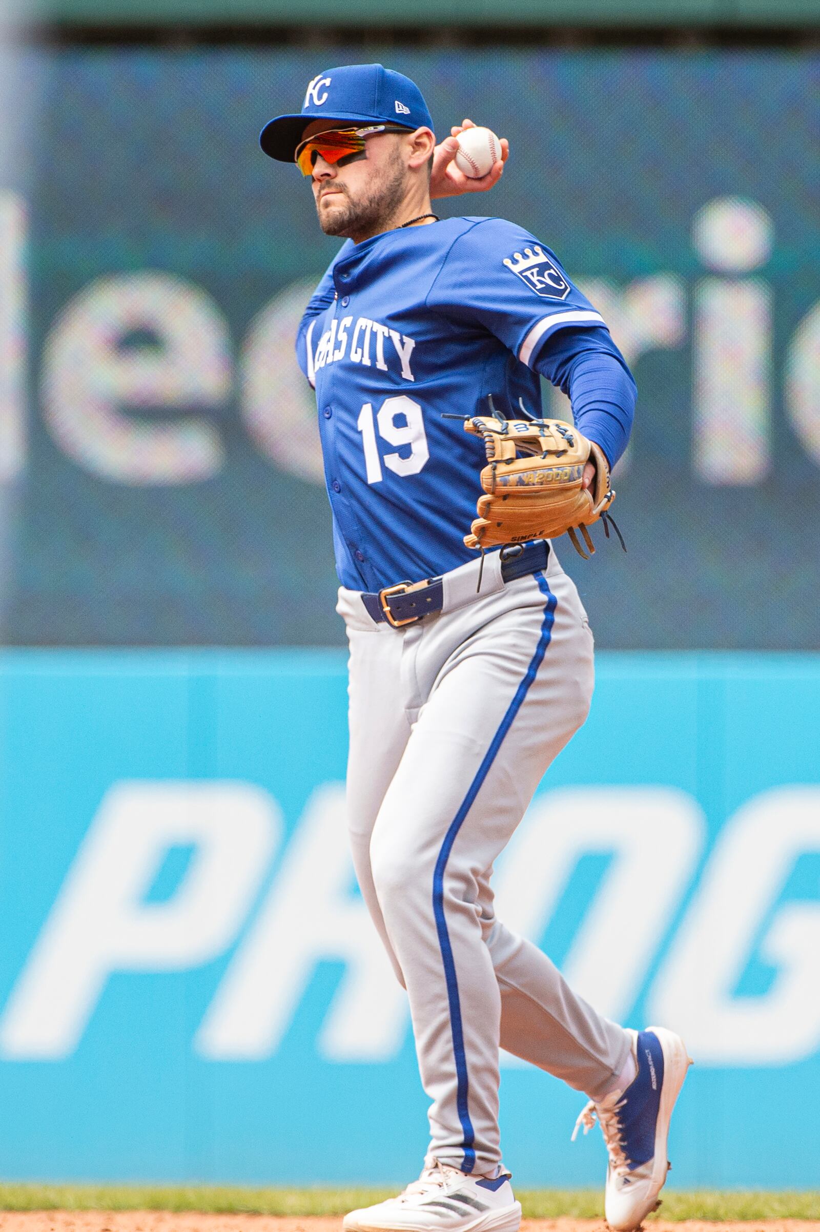 Kansas City Royals' Michael Massey throws out Cleveland Guardians' Steven Kwan during the sixth inning of a baseball game in Cleveland, Sunday, April 13, 2025. (AP Photo/Phil Long)