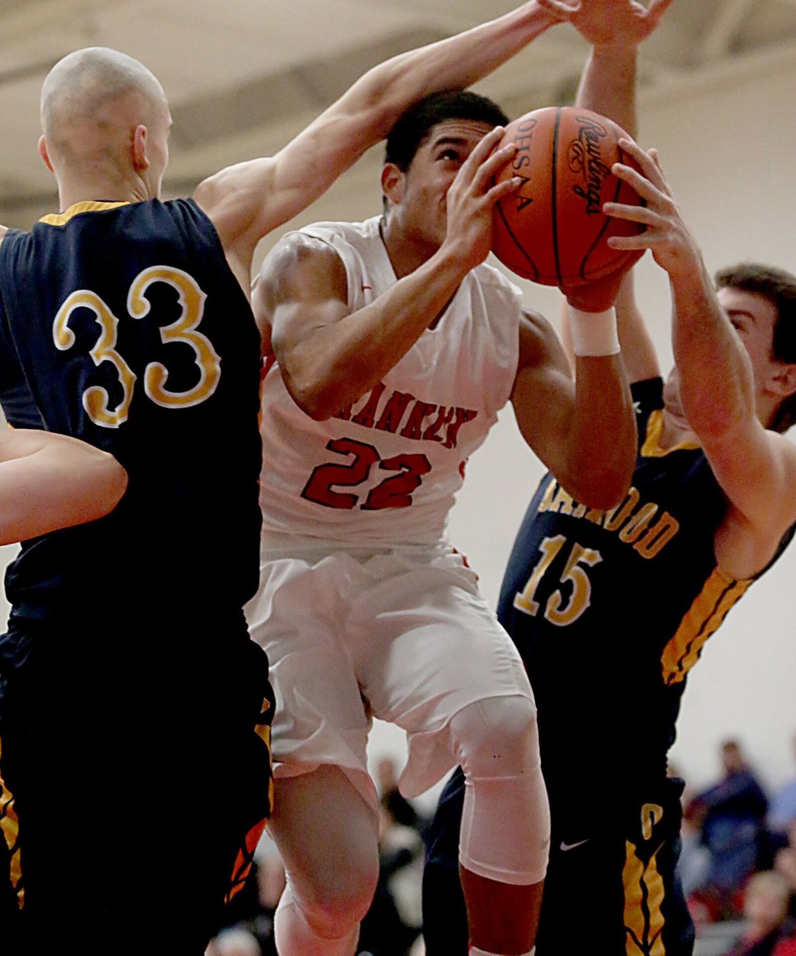 Franklin’s Ryan Montgomery cuts through Oakwood defenders Andy Neff (33) and Brock Gorman (15) on Tuesday night during their game at Darrell Hedric Gymnasium in Franklin. CONTRIBUTED PHOTO BY E.L. HUBBARD