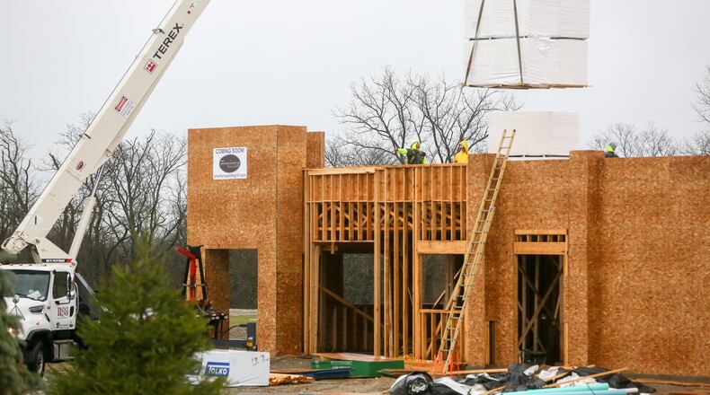 Construction continues March 1 on the new Shooters Sports Grill, located along Ohio 747 in front of the Carriage Hill subdivision in Liberty Twp. The business is expected to open in June. GREG LYNCH/STAFF
