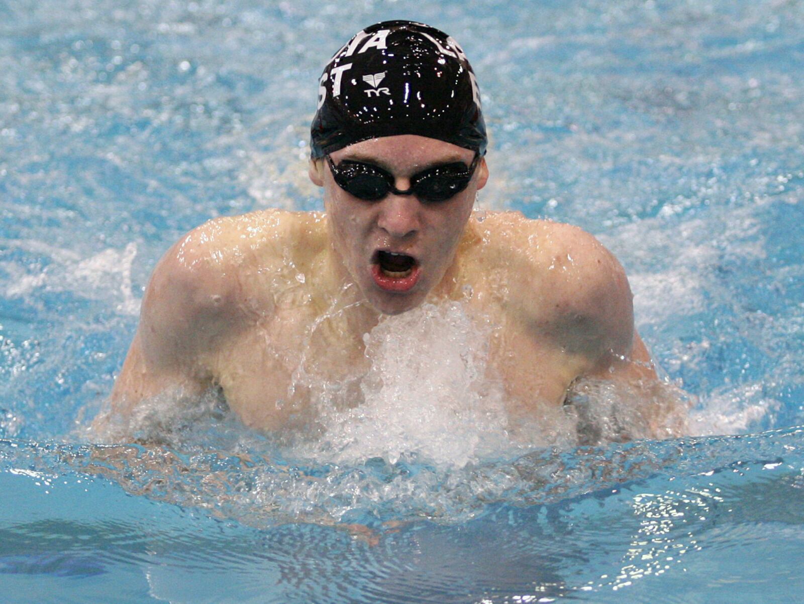 Lakota East junior Jared Miller swims the breaststroke leg of the 200-yard individual medley in the state meet at C.T. Branin Natatorium in Canton. Miller won the event to become the first state swim champ in school history. john Boyle/STAFF