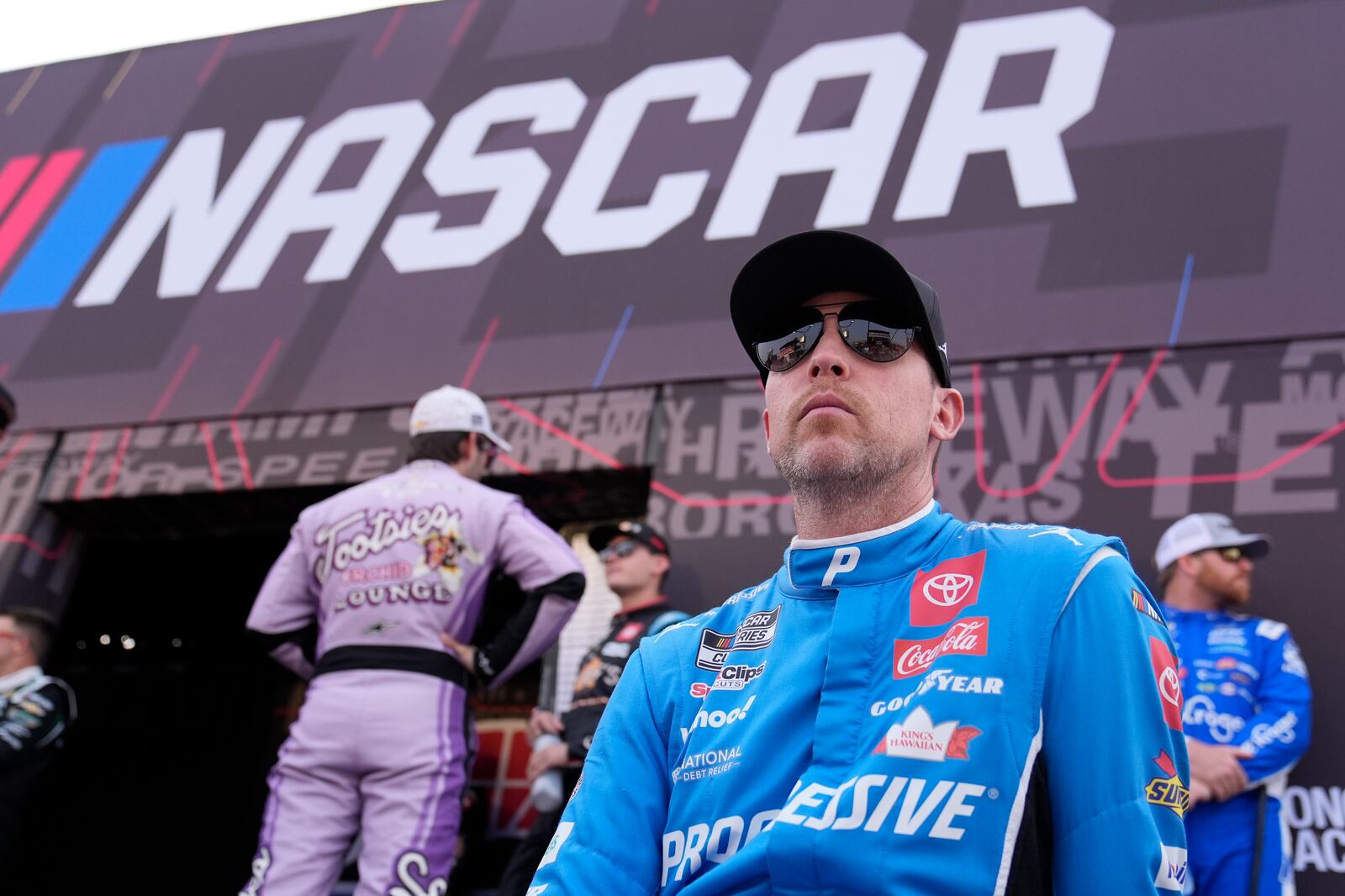 Denny Hamlin waits to be introduced before a NASCAR Cup Series auto race Sunday, June 1, 2025, in Lebanon, Tenn. (AP Photo/George Walker IV)