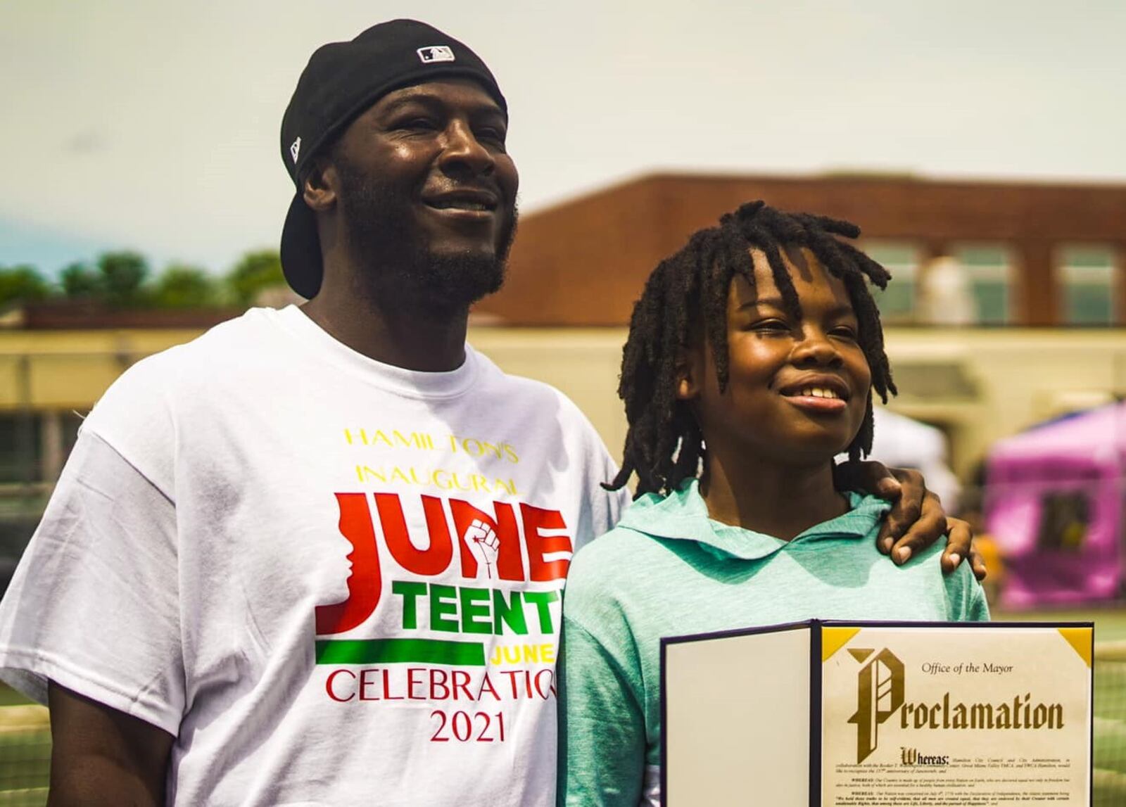 DeMauntezz Oatis and Deion Oatis receive a proclamation after going to Hamilton City Council in 2020, where Juneteenth was declared a holiday in the City of Hamilton. DeMauntezz is Deion's father. CONTRIBUTED