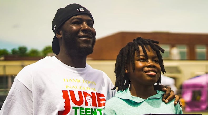 DeMauntezz Oatis and Deion Oatis receive a proclamation after going to Hamilton City Council in 2020, where Juneteenth was declared a holiday in the City of Hamilton. DeMauntezz is Deion's father. CONTRIBUTED