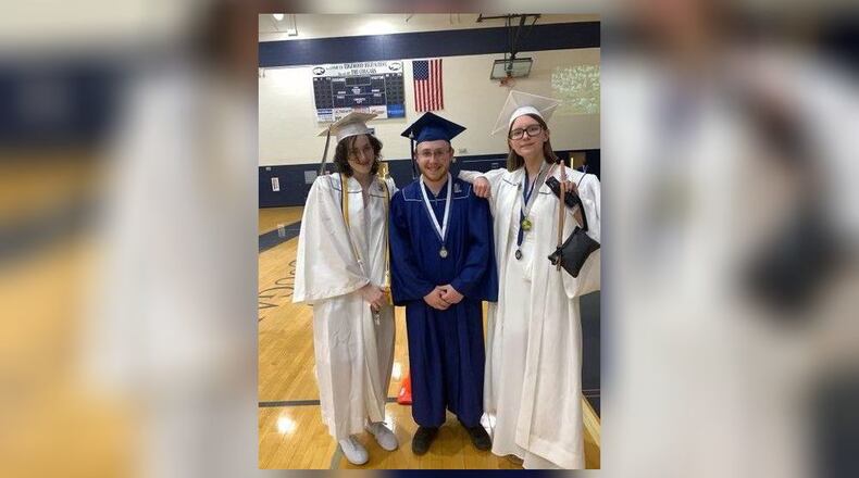 Recent Edgewood High School graduate Connor Fluhart, center among fellow graduates. (Provided Photo\Journal-News)