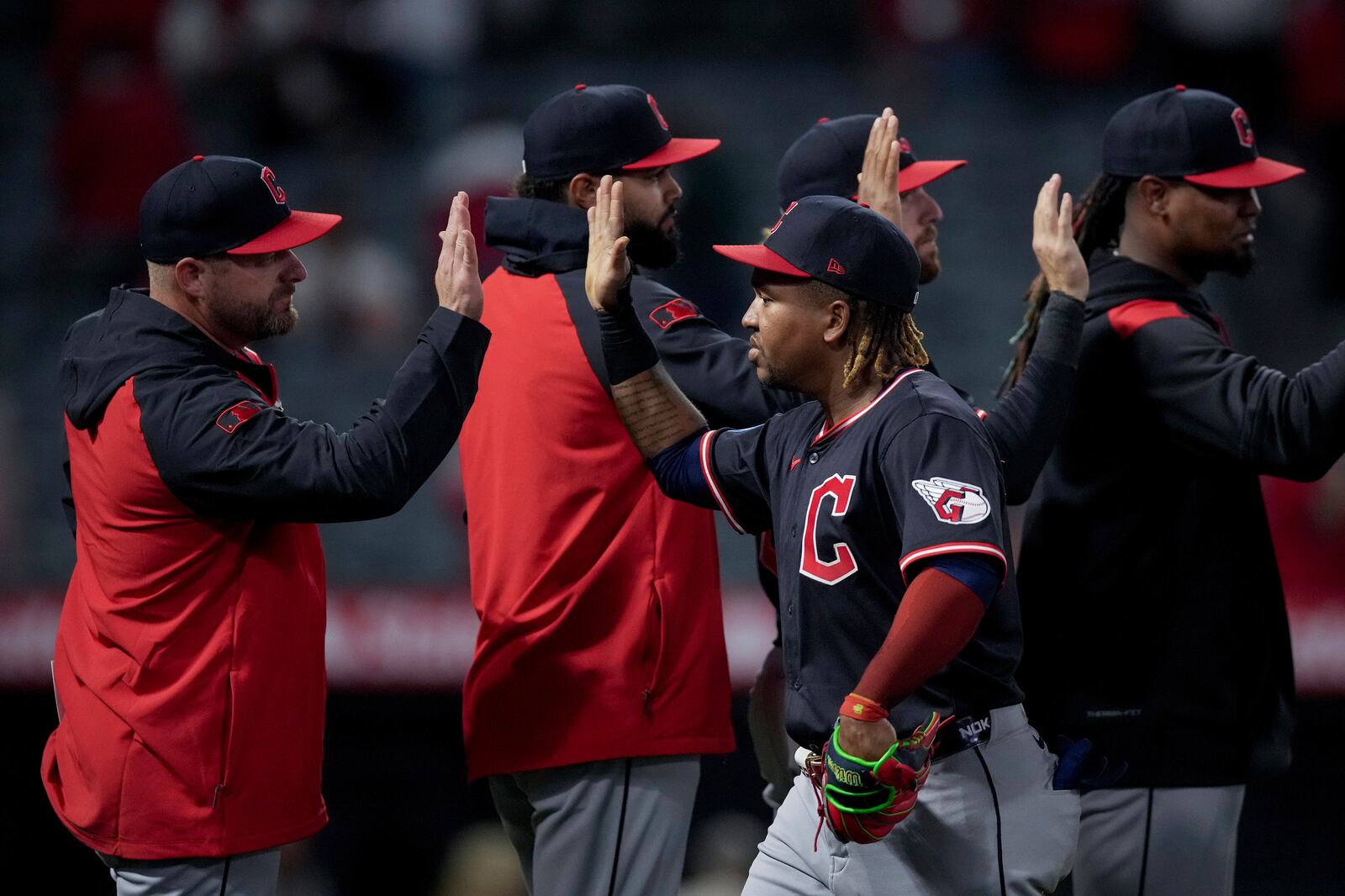 Cleveland Guardians Jose Ramirez, center, celebrates with teammates after a baseball game against the Los Angeles Angels in Anaheim, Calif., Friday, April 4, 2025. (AP Photo/Eric Thayer)