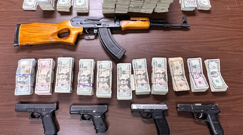 Here are the items that were seized on Feb. 1 when Middletown police and other police officials searched two Middletown residences. Two people were charged and their cases were sent to a Butler County grand jury. SUBMITTED PHOTO