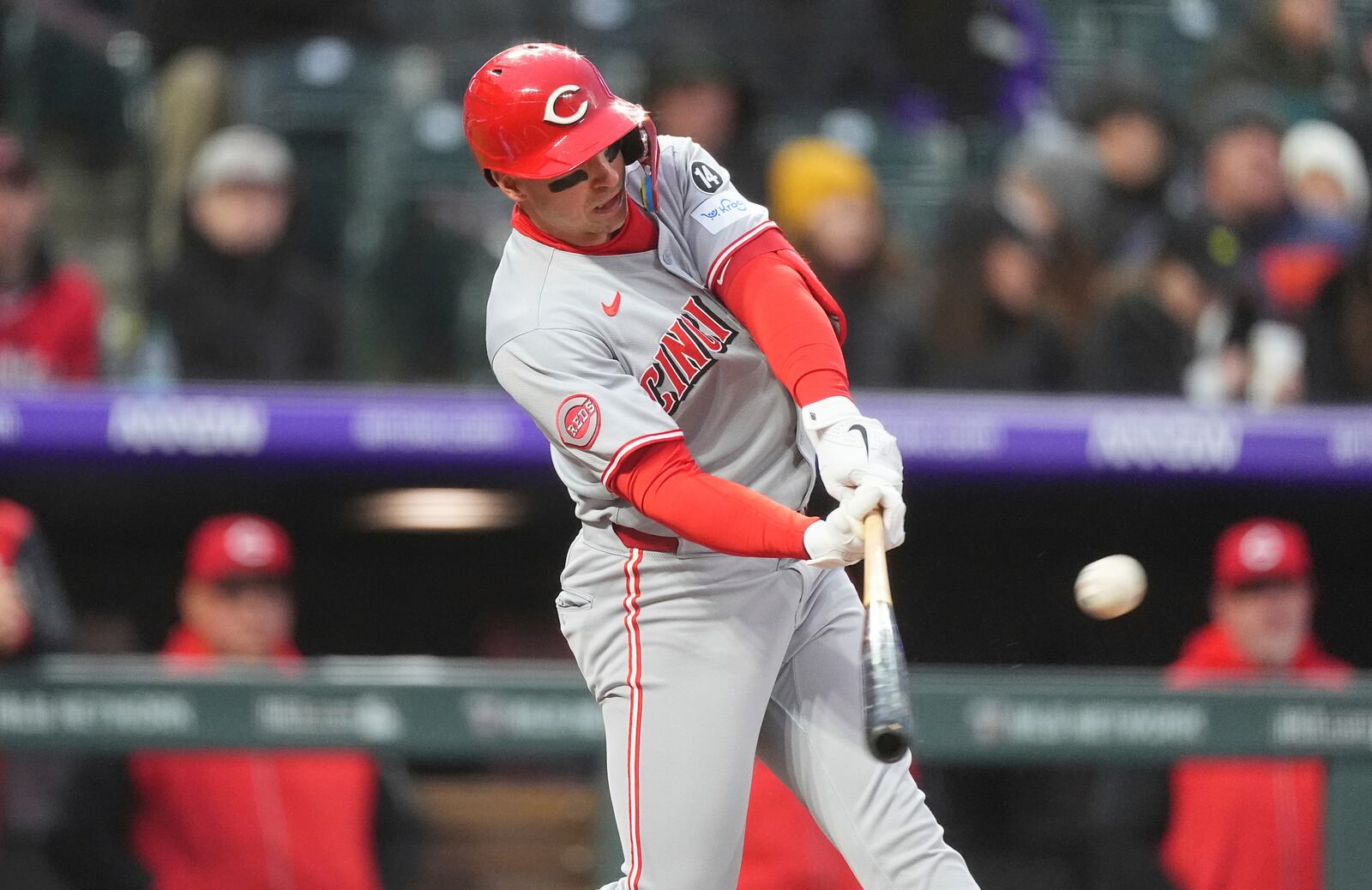 Cincinnati Reds' Spencer Steer flies out against Colorado Rockies starting pitcher Kyle Freeland to end the top of the first inning of a baseball game Friday, April 25, 2025, in Denver. (AP Photo/David Zalubowski)