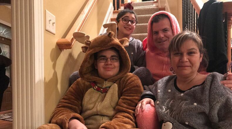 The Martin family in special pajamas. Front row: Max, Dulcie. Top: Emma and Chuck.