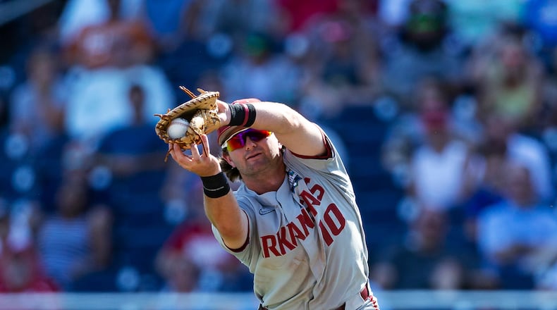 Arkansas first baseman Peyton Stovall makes a catch for an out against Mississippi during the ninth of an NCAA College World Series baseball game Thursday, June 23, 2022, in Omaha, Neb. (AP Photo/John Peterson)