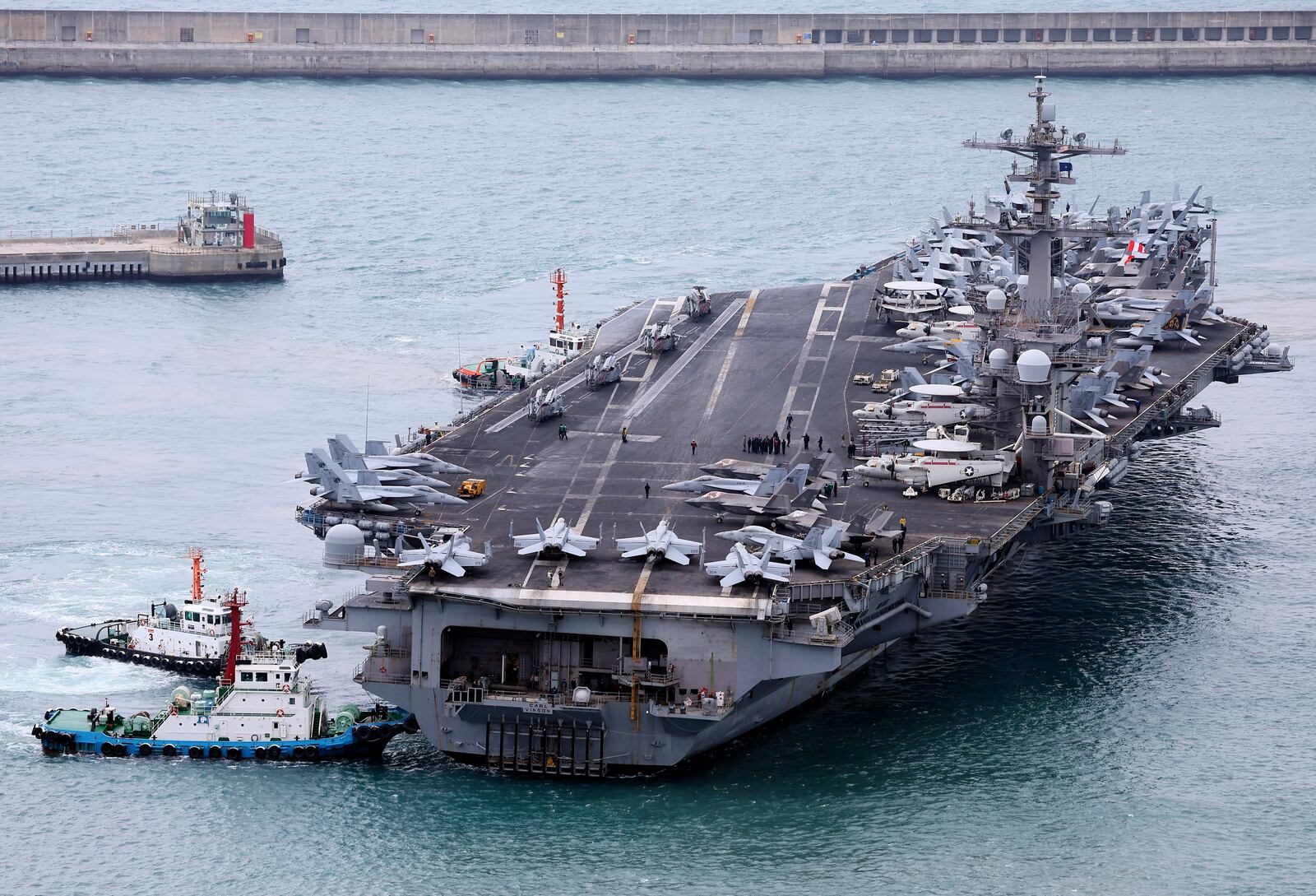 FILE - The USS Carl Vinson aircraft carrier is escorted into a navy port in Busan, South Korea, March 2, 2025. (Son Hyung-ju/Yonhap via AP, File)