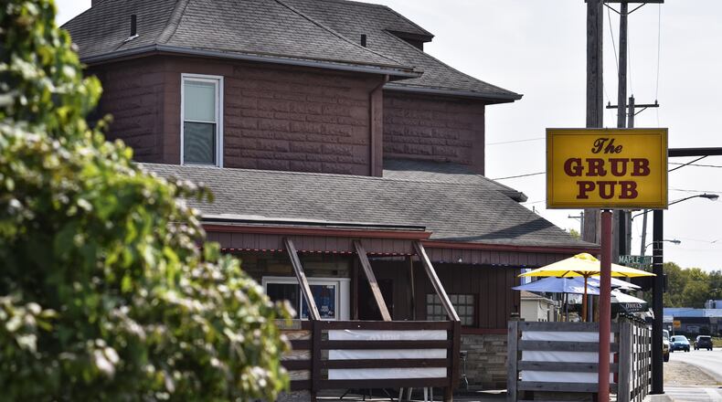 The Grub Pub in Hamilton was cited Friday for serving alcohol after the 10 p.m. coronavirus curfew, something bar owners say is causing them financial issues. NICK GRAHAM/STAFF