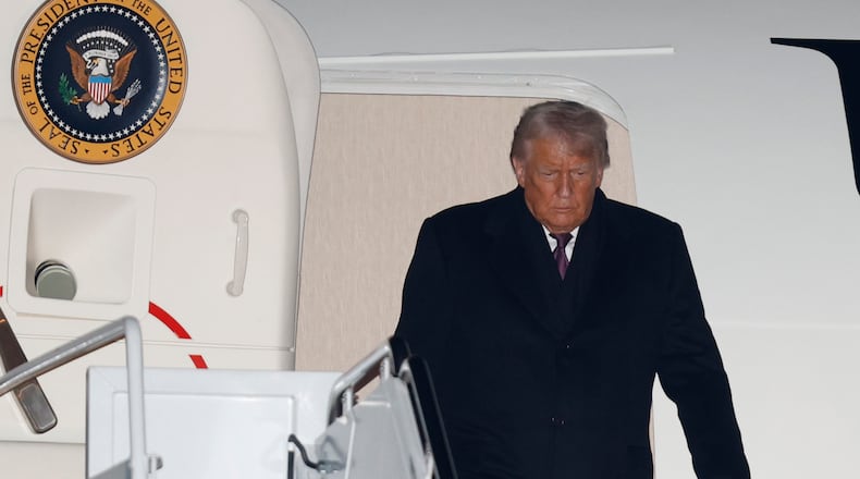 President Donald Trump arrives on Air Force One at Joint Base Andrews, Md., Thursday, Jan. 22, 2026, after returning from the World Economic Forum in Davos.(AP Photo/Luis M. Alvarez)