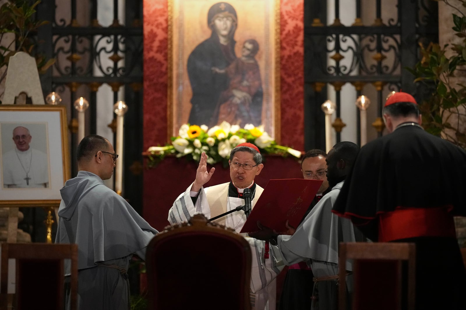 Cardinal Luis Antonio Gokim Tagle leads a rosary prayer outside the Santa Maria Maggiore Basilica, where the late Pope Francis will be buried, in Rome, Thursday, April 24, 2025. (AP Photo/Andreea Alexandru)