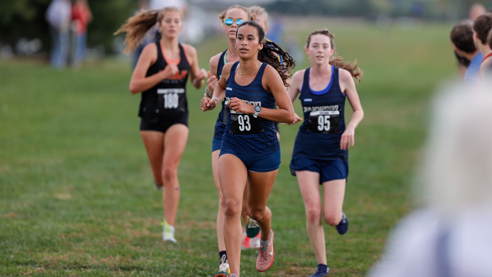 Oakwood High School junior Isla Dunlap leads a pack of Lumberjills runners that include junior teammates Katherine Erwin and Sylvia Gallagher Yerman at the Division III district cross country meet held Saturday, Oct. 18 at Cedarville University. MICHAEL COOPER / STAFF