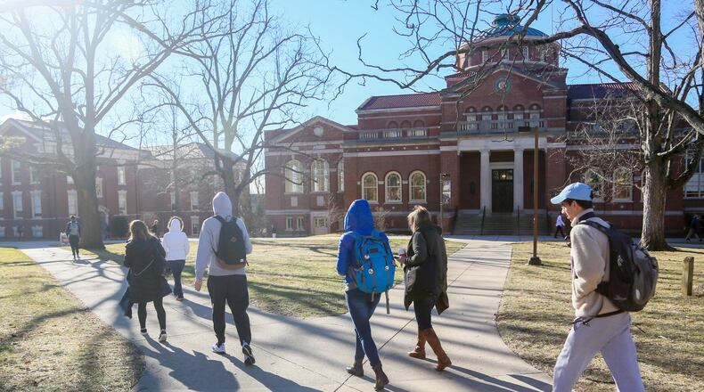 Students walk through the campus of Miami University in Oxford on Feb. 15. GREG LYNCH / STAFF